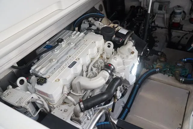 Slide: The Image of Engine compartment of 2010 Sea Ray 470 Sundancer yacht, showcasing detailed machinery. - 30