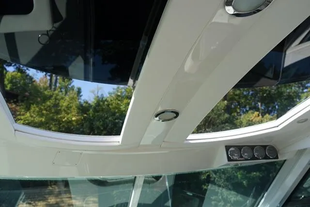 Slide: The Image of Interior view of 2010 Sea Ray 470 Sundancer yacht with sunroof and sleek design. - 5