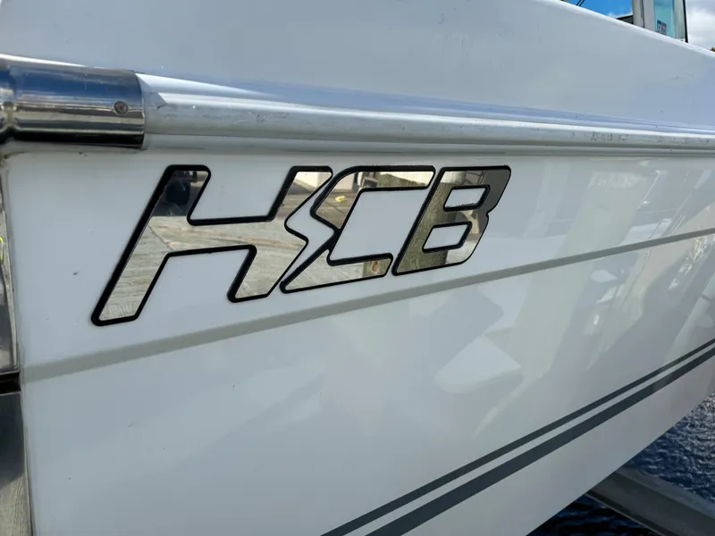 Slide: The Image of 2019 HCB Siesta boat logo on white hull. - 11