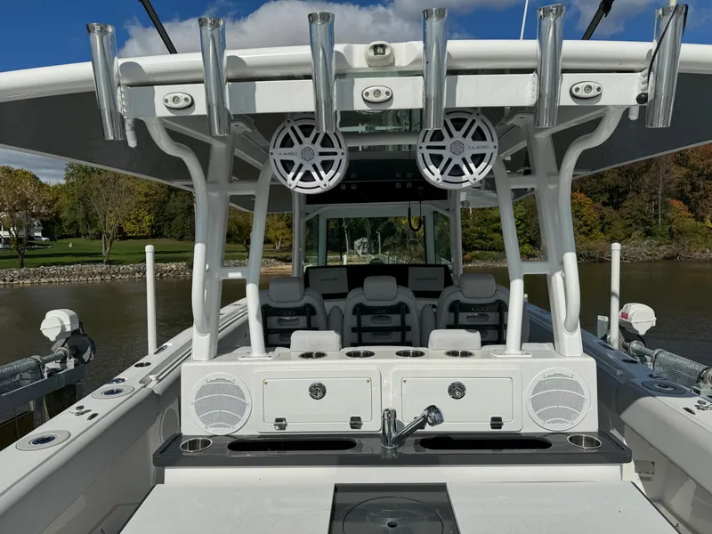 Slide: The Image of 2019 HCB Siesta boat with fishing rod holders and seating area. - 14