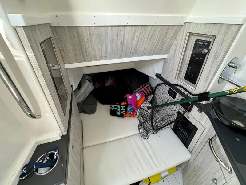 Slide: The Image of 2019 HCB Siesta cabin interior with storage and fishing gear. - 27