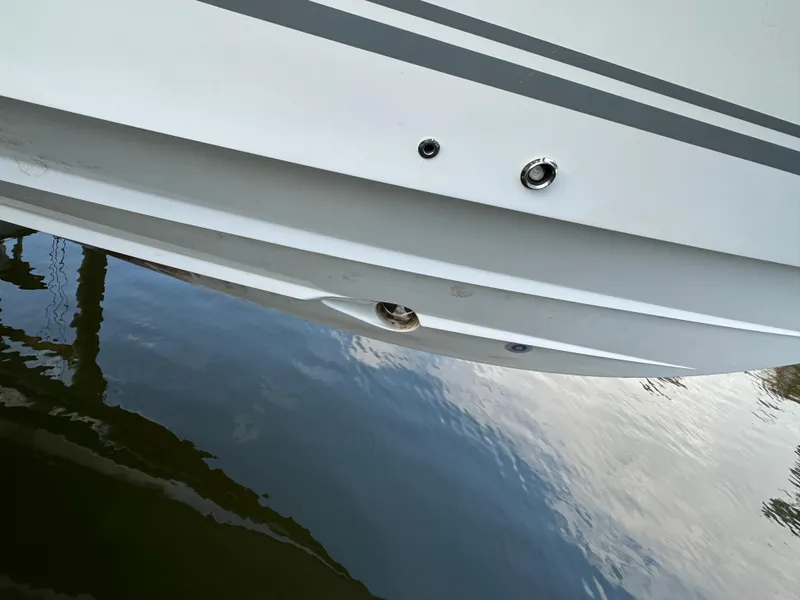 Slide: The Image of Close-up of 2019 HCB Siesta boat hull reflecting on water. - 3