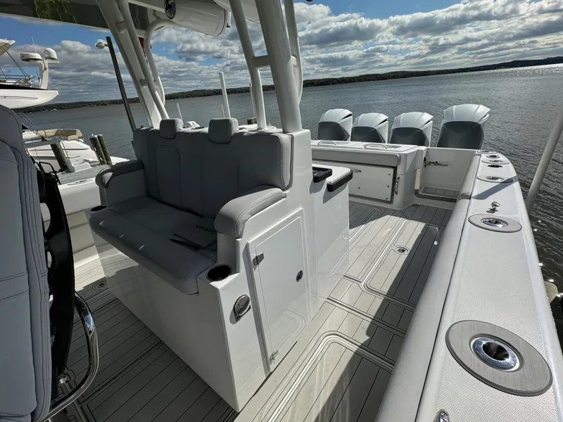 Slide: The Image of 2019 HCB Siesta boat interior with seating and multiple outboard engines. - 35