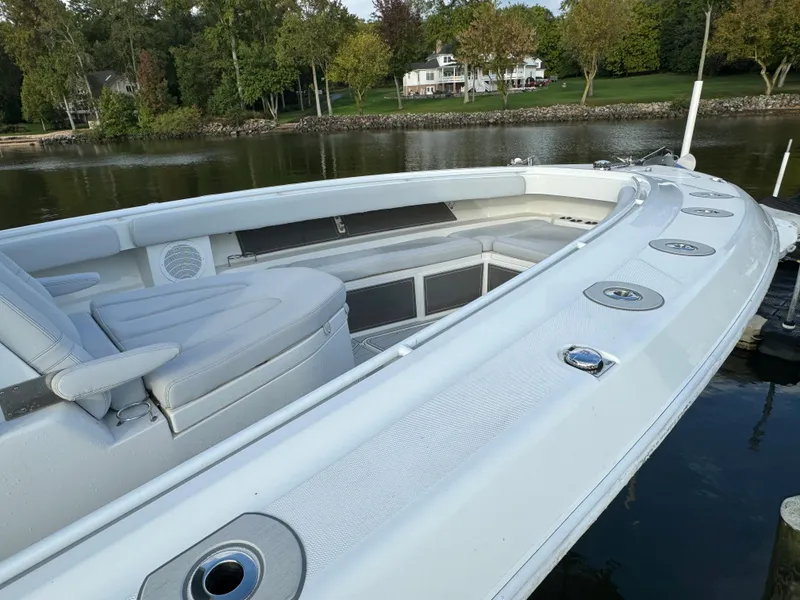 Slide: The Image of 2019 HCB Siesta boat docked by a serene lakeside. - 4