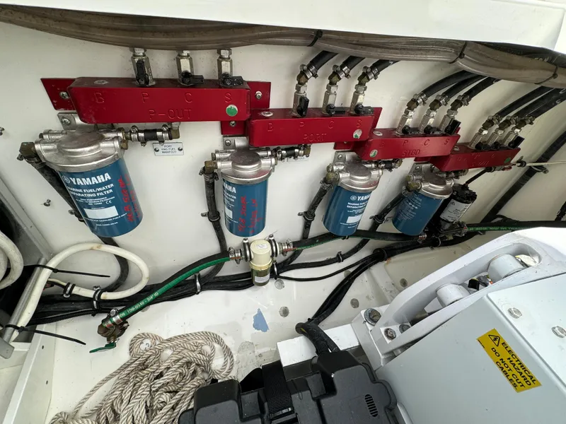 Slide: The Image of 2019 HCB Siesta engine compartment with Yamaha fuel filters and wiring. - 41