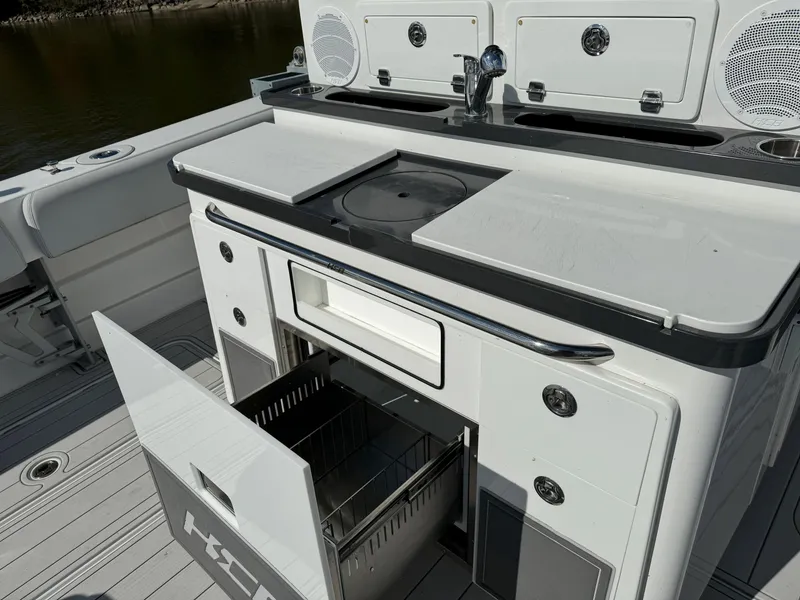Slide: The Image of 2019 HCB Siesta boat kitchen with open storage drawer and sink. - 13