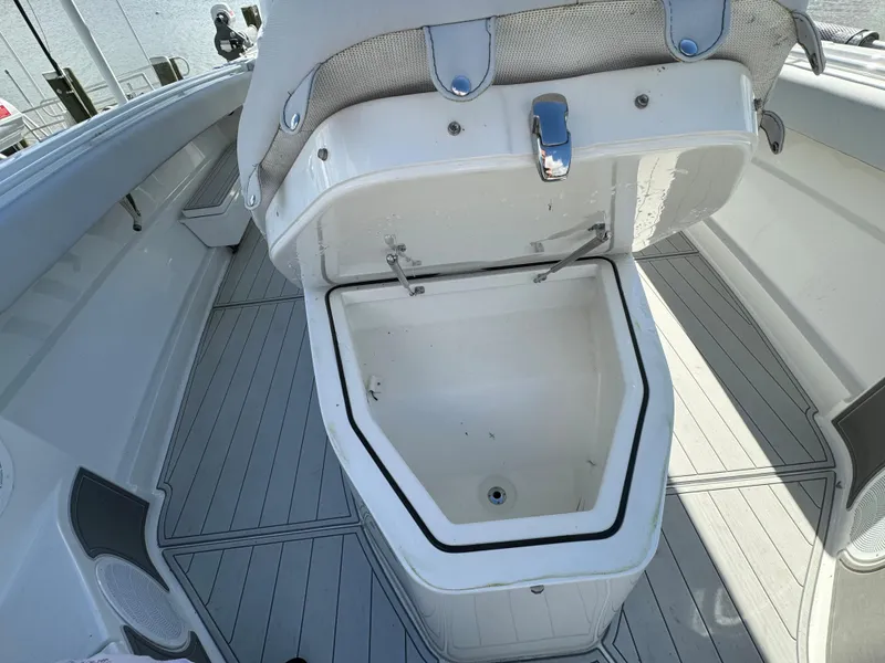 Slide: The Image of 2019 HCB Siesta boat with open storage compartment on deck. - 22