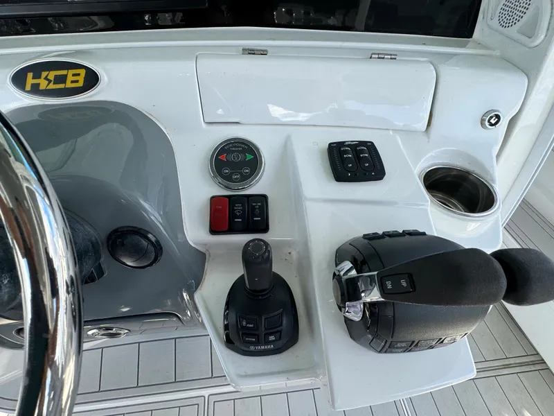 Slide: The Image of Control panel of a 2019 HCB Siesta boat with steering wheel and throttle. - 31