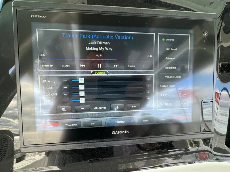 Slide: The Image of Garmin touchscreen displaying music controls on a 2019 HCB Siesta boat. - 33