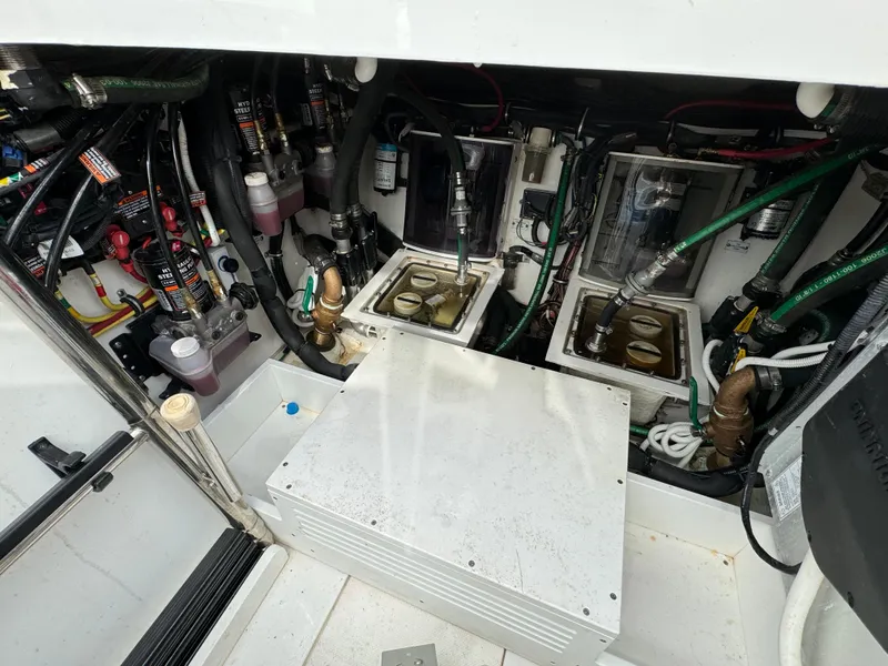 Slide: The Image of Engine room of a 2019 HCB Siesta boat with various mechanical components. - 38