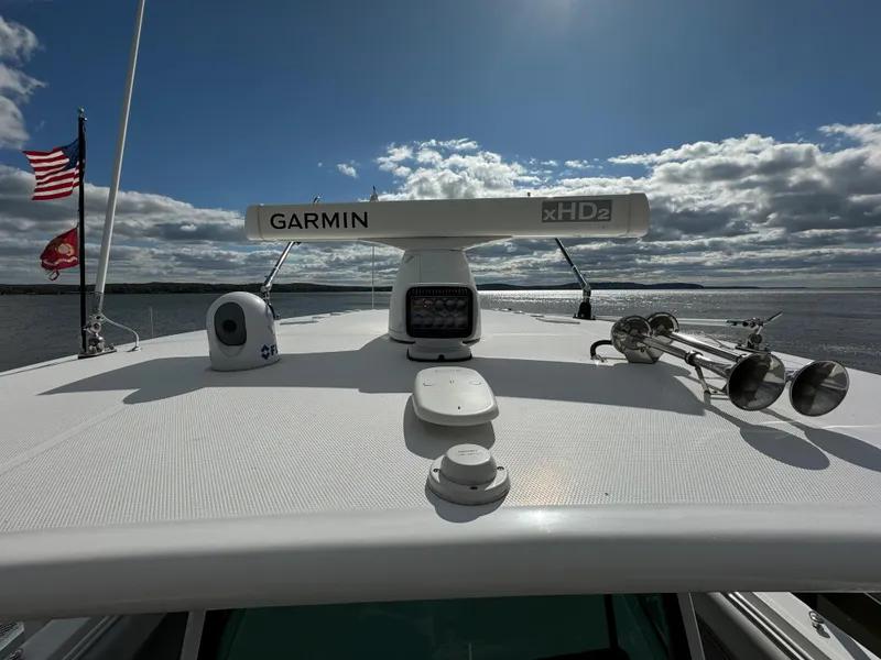 Slide: The Image of 2019 HCB Siesta boat with Garmin xHD2 radar on the roof, American flag in the background. - 45