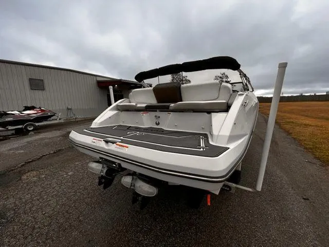 Slide: The Image of 2014 Scarab 215 boat rear view at a dock. - 12