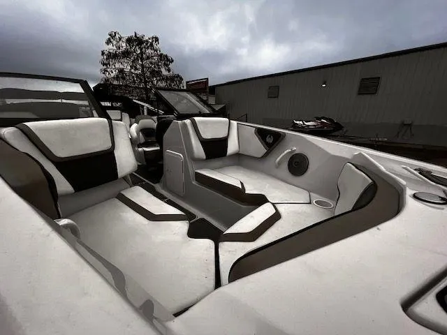 Slide: The Image of 2014 Scarab 215 boat interior with white and black seating. - 8