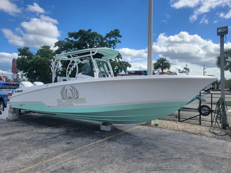 The Image of 2024 Wellcraft 302 Fisherman boat on display under a clear blue sky. - 0