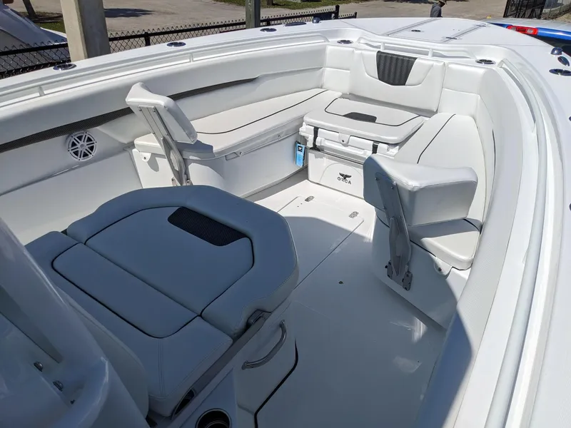 Slide: The Image of 2024 Wellcraft 302 Fisherman boat interior with seating and storage. - 14
