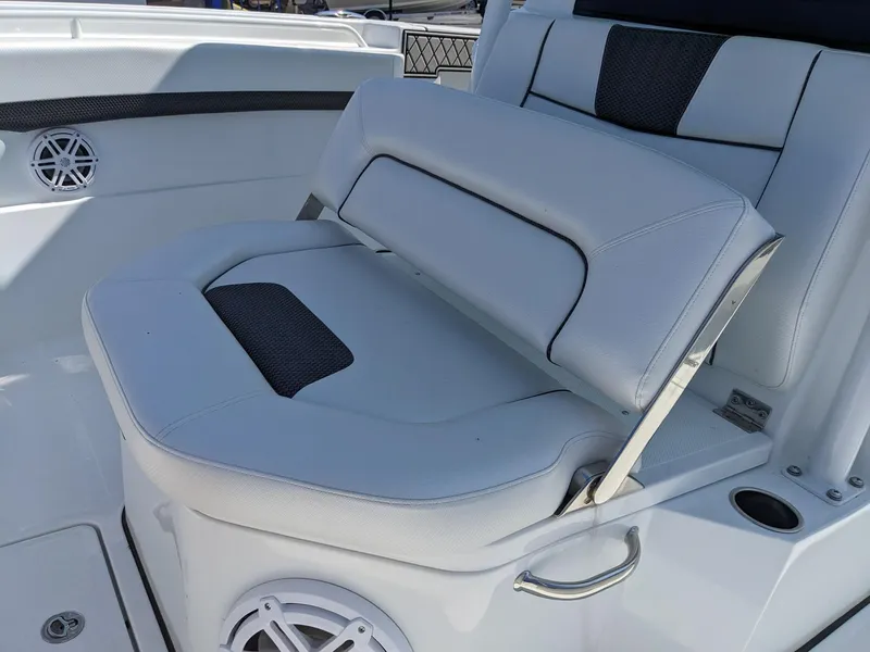 Slide: The Image of 2024 Wellcraft 302 Fisherman boat seating with white and black upholstery. - 16
