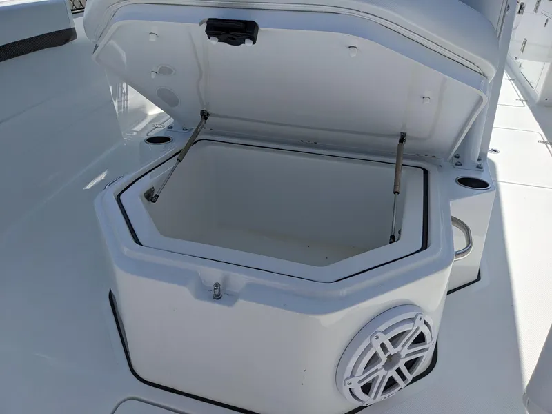 Slide: The Image of 2024 Wellcraft 302 Fisherman boat storage compartment with open lid. - 17