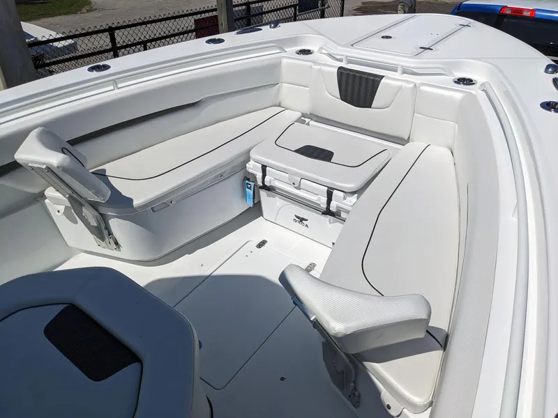 Slide: The Image of 2024 Wellcraft 302 Fisherman boat interior with seating and storage. - 18