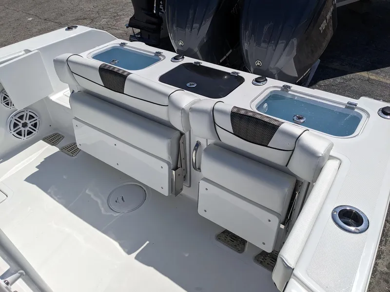 Slide: The Image of 2024 Wellcraft 302 Fisherman boat with dual livewells and foldable seating. - 2