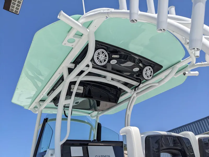 Slide: The Image of 2024 Wellcraft 302 Fisherman boat with overhead electronics and speakers. - 22