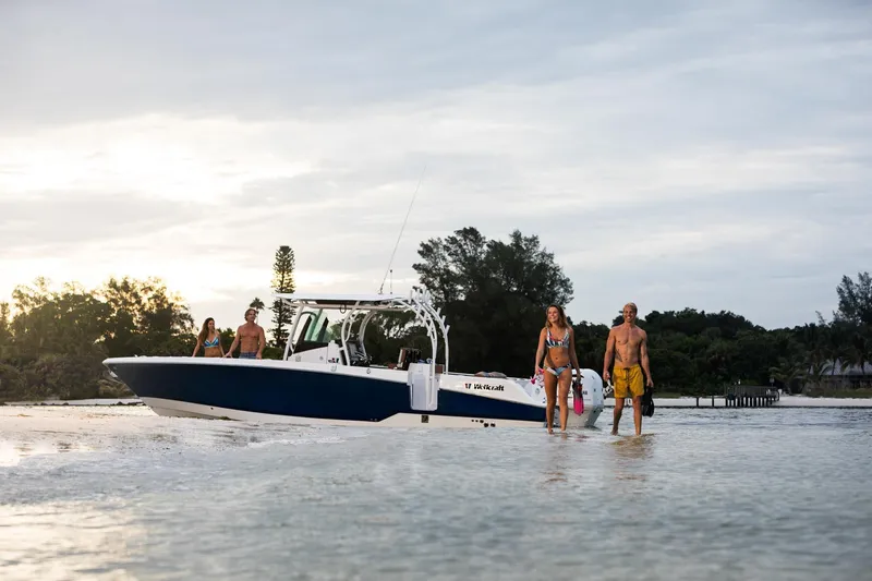 Slide: The Image of 2024 Wellcraft 302 Fisherman boat with people enjoying the water. - 27