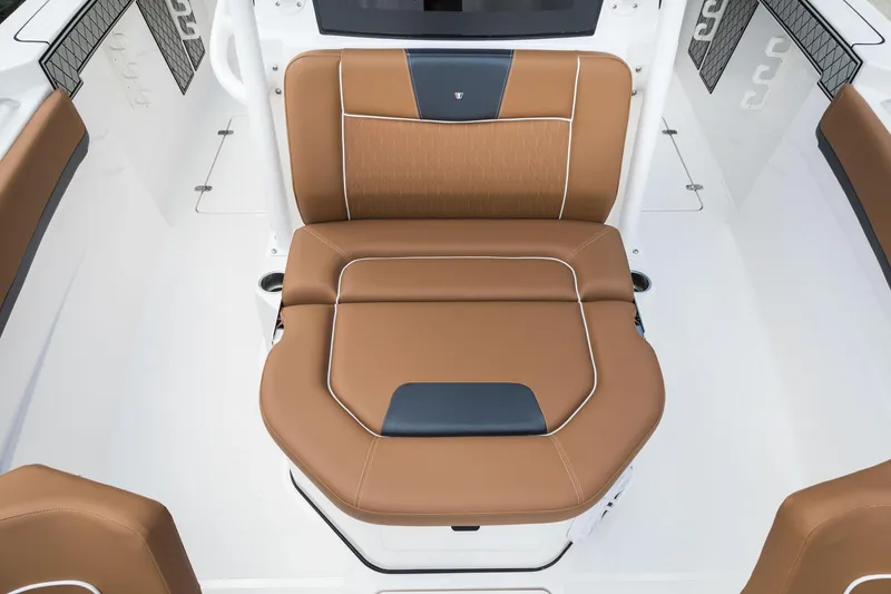 Slide: The Image of 2024 Wellcraft 302 Fisherman boat seat with brown and black cushioned upholstery. - 38