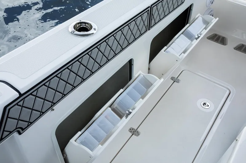 Slide: The Image of 2024 Wellcraft 302 Fisherman boat interior storage compartments and rod holders. - 46