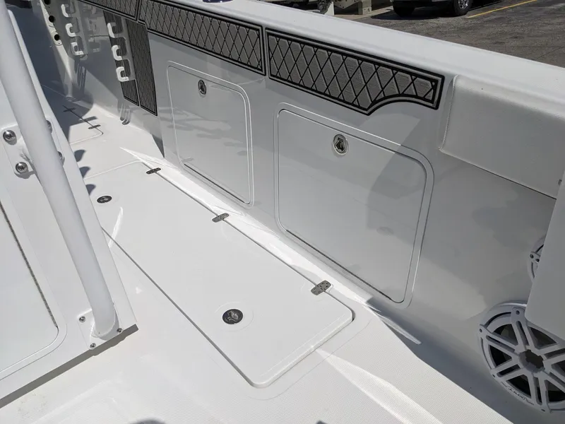 Slide: The Image of 2024 Wellcraft 302 Fisherman boat deck with storage compartments. - 7