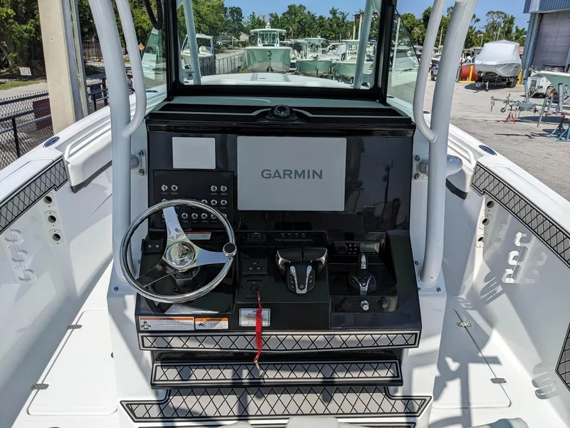 Slide: The Image of 2024 Wellcraft 302 Fisherman boat helm with Garmin navigation system. - 8