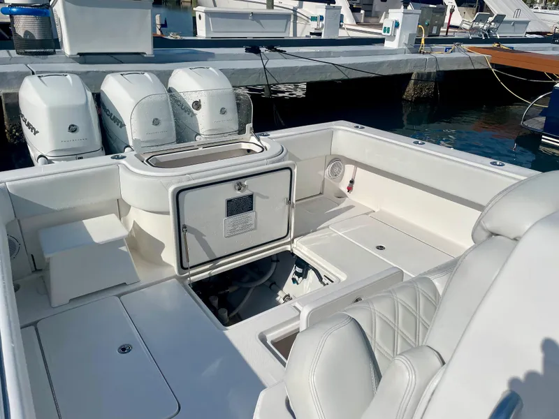 Slide: The Image of 2019 Invincible 39 Open Fisherman boat with triple outboard engines at dock. - 13