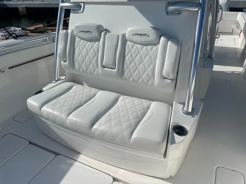 Slide: The Image of 2019 Invincible 39 Open Fisherman boat with cushioned seating and stainless steel frame. - 14