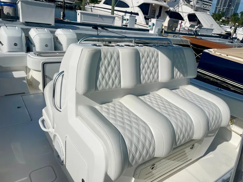 Slide: The Image of 2019 Invincible 39 Open Fisherman boat with white cushioned seating. - 3