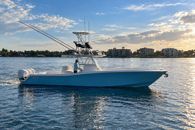 The Image of 2019 Invincible 39 Open Fisherman boat cruising on calm waters at sunset. - 0