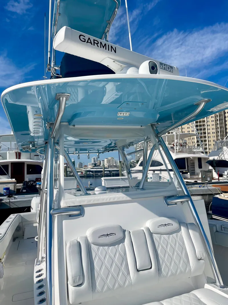 Slide: The Image of 2019 Invincible 39 Open Fisherman boat with Garmin radar at marina. - 9