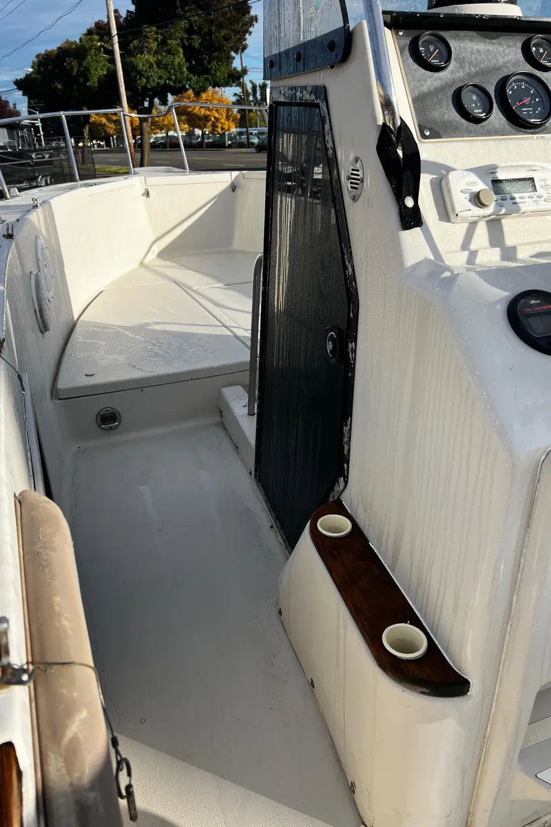 Slide: The Image of 1988 Sea Ray Laguna 23 boat interior with dashboard and seating area. - 17