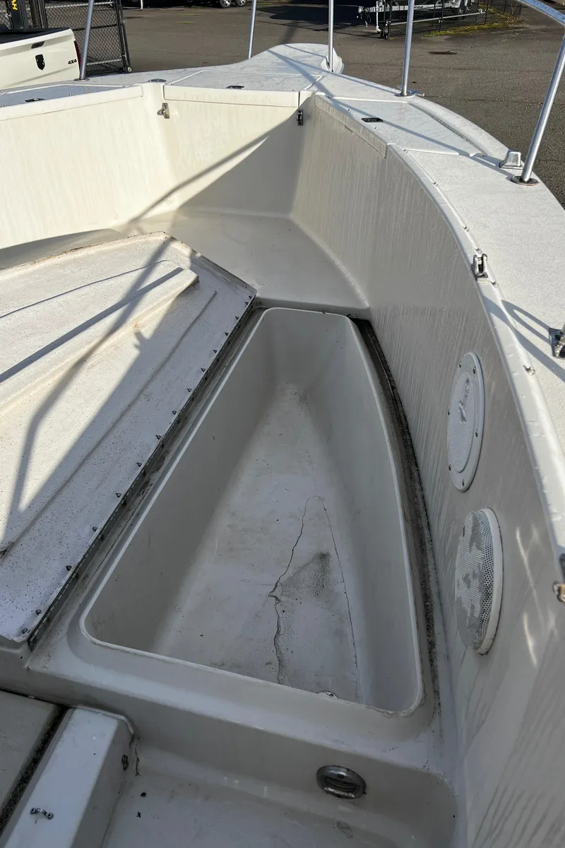 Slide: The Image of 1988 Sea Ray Laguna 23 boat interior, showing spacious storage compartment. - 19