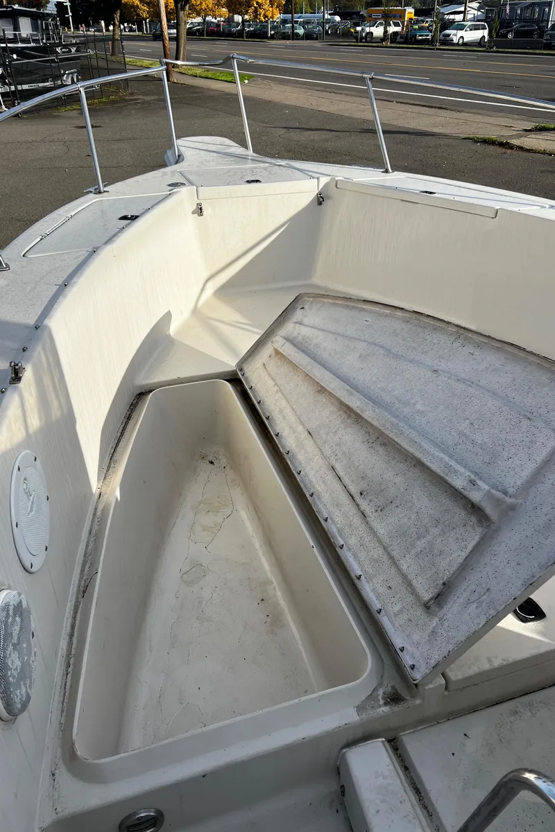 Slide: The Image of 1988 Sea Ray Laguna 23 boat with open storage compartment. - 20