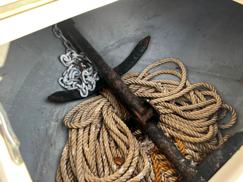 Slide: The Image of Anchor and ropes in the storage compartment of a 1988 Sea Ray Laguna 23 boat. - 23