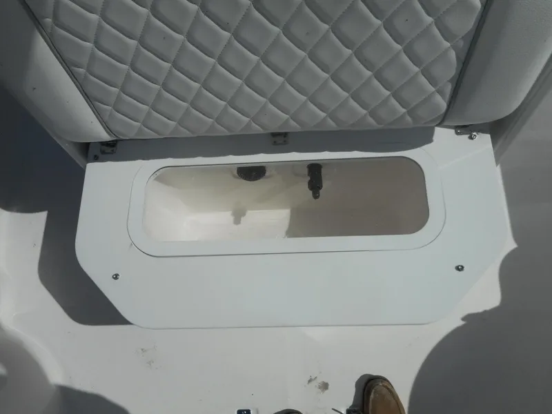 Slide: The Image of 2024 Sea Fox 251 BAYFOX boat storage compartment with cushioned seat. - 15