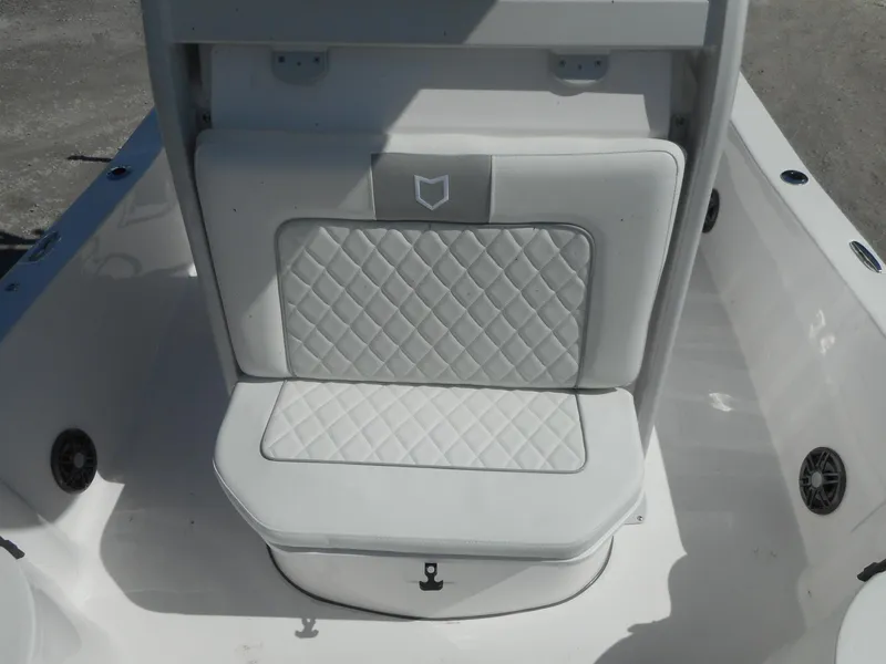 Slide: The Image of 2024 Sea Fox 251 BAYFOX boat with cushioned seating and storage. - 16