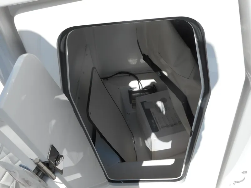 Slide: The Image of 2024 Sea Fox 251 BAYFOX storage compartment with electrical components. - 17