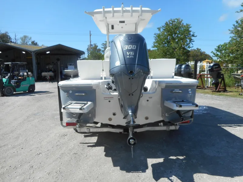 Slide: The Image of 2024 Sea Fox 251 BAYFOX boat with 300 V6 outboard motor, rear view. - 2