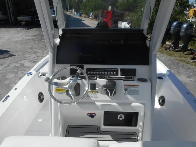 Slide: The Image of 2024 Sea Fox 251 BAYFOX boat console with steering wheel and controls. - 5