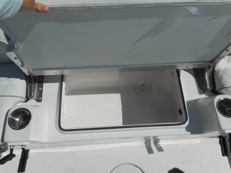 Slide: The Image of 2024 Sea Fox 251 BAYFOX boat storage compartment with cup holders. - 8