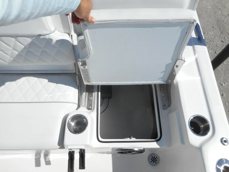 Slide: The Image of 2024 Sea Fox 251 BAYFOX boat storage compartment with white cushioned seating. - 9