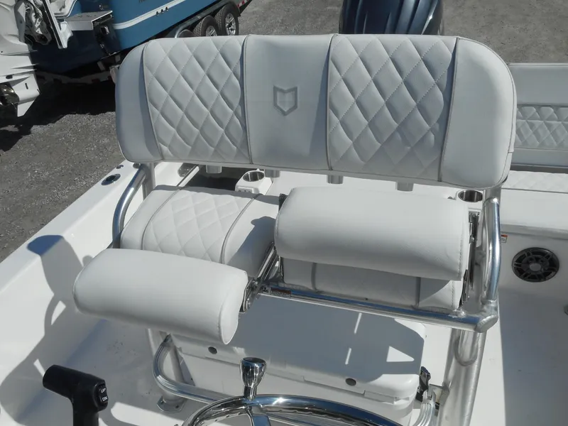 Slide: The Image of 2024 Sea Fox 231 BAYFOX boat with cushioned seating and stainless steel frame. - 10