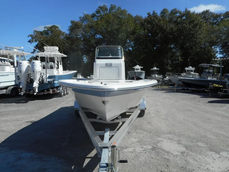 Slide: The Image of 2024 Sea Fox 231 BAYFOX boat on a trailer in a marina. - 2
