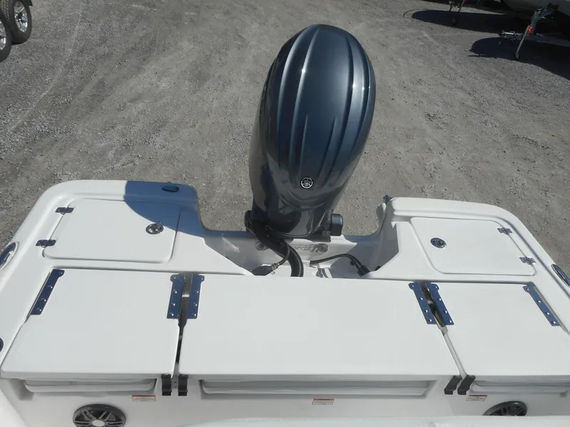 Slide: The Image of 2024 Sea Fox 231 BAYFOX boat with outboard motor and storage compartments. - 5
