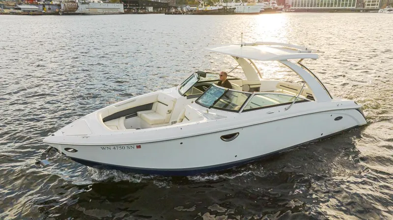 Slide: The Image of 2018 Cobalt 30 R boat cruising on a sunny day. - 18