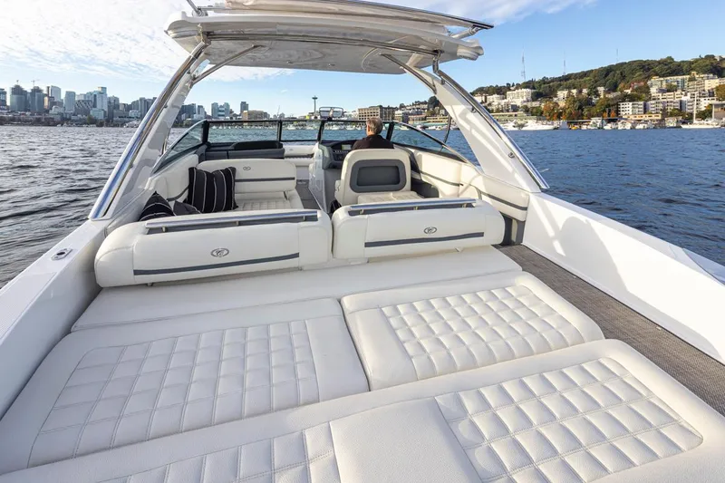 Slide: The Image of 2018 Cobalt 30 R luxury boat with spacious seating and scenic waterfront view. - 23